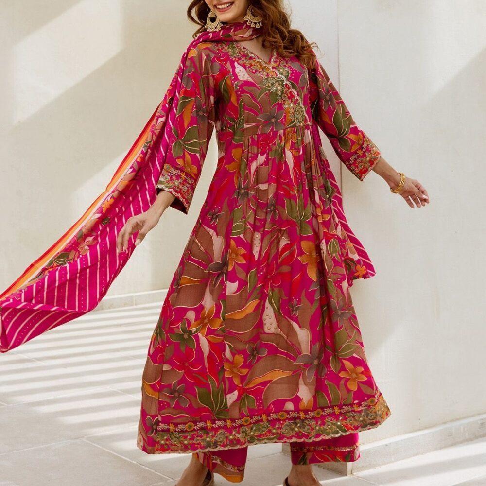Product Details Pink, orange and gold-toned kurta with palazzos and dupatta Kurta design: Floral printed Anarkali shape Angrakha style V-neck Three-quarter regular sleeves Calf length with flared hem Machine weave fabric Palazzos design: Solid palazzos, has a printed border Elasticated waistband Slip-on closure Dupatta design: Printed dupatta, has a tassels detailing Solid border Size & Fit The model (height 5'8) is wearing a size S Size Bust (in) Front Length (in) To Fit Waist (in) Waist (in) Hips (in) Across Shoulder (in) Inseam Length (in) S 38.5 44.0 32.5 36.5 40.5 15.0 37.0 M 40.5 44.0 34.5 38.5 42.5 15.5 37.0