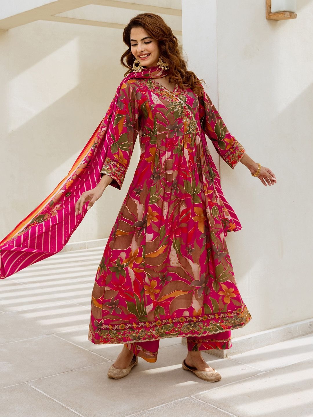 imgi_123_0333144d-67ac-4ae4-a930-dee902f65ce81738048214987-Ishin-Floral-Printed-Pure-Cotton-Thread-work-Anarkali-Kurta--6 Product Details Pink, orange and gold-toned kurta with palazzos and dupatta Kurta design: Floral printed Anarkali shape Angrakha style V-neck Three-quarter regular sleeves Calf length with flared hem Machine weave fabric Palazzos design: Solid palazzos, has a printed border Elasticated waistband Slip-on closure Dupatta design: Printed dupatta, has a tassels detailing Solid border Size & Fit The model (height 5'8) is wearing a size S Size Bust (in) Front Length (in) To Fit Waist (in) Waist (in) Hips (in) Across Shoulder (in) Inseam Length (in) S 38.5 44.0 32.5 36.5 40.5 15.0 37.0 M 40.5 44.0 34.5 38.5 42.5 15.5 37.0