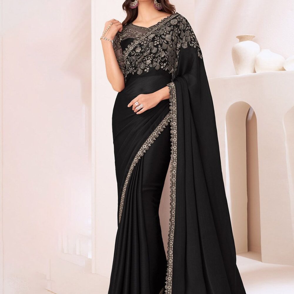 Product Details Design Details Black and grey saree Solid saree with embellished border border Has sequinned detail The saree comes with an unstitched blouse piece The blouse worn by the model might be for modelling purpose only. Check the image of the blouse piece to understand how the actual blouse piece looks like. Size & Fit Length: 5.5 metres plus 0.8 metre blouse piece Width: 1.06 metres (approx.) Material & Care Dry Clean
