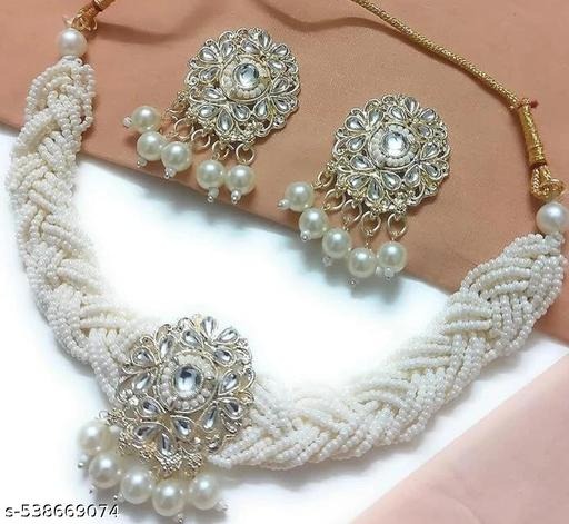 Bring timeless elegance to your collection with Elegance Woven: Pearl & Kundan Choker with Earrings, designed to add a regal charm to every occasion. Crafted from premium alloy, plated with long-lasting gold, and adorned with lustrous pearls, sparkling Kundan, and brilliant American diamonds (Cubic Zirconia) – this set is a perfect combination of tradition and luxury. The pearl and Kundan choker set comes with matching earrings, making it a complete festive and bridal jewellery choice. Whether you’re dressing for weddings, receptions, festivals like Diwali & Karva Chauth, or glamorous parties, this American Diamond choker set with pearls enhances your style instantly. ✨ Key Features: Base Metal: Alloy Plating: Gold Plated Stones: Kundan, Pearls & Cubic Zirconia (American Diamonds) Includes: Choker Necklace + Matching Earrings This bridal choker necklace with earrings pairs beautifully with sarees, lehengas, gowns, and Indo-western dresses, giving you a royal yet modern touch. The combination of pearl beads and Kundan stones reflects Indian tradition, while the American diamonds bring a shimmering sparkle perfect for today’s fashion. 👉 Explore this exclusive design at https://dealdynamo.vinisocial.in . 🔹 Product Highlights ✅ Alloy base with gold plating for durability & shine ✅ Elegant combination of pearls, Kundan & American diamonds ✅ Choker necklace with matching earrings for a complete look ✅ Lightweight & comfortable for weddings and long events ✅ Perfect for brides, bridesmaids & festive occasions 🔹 Variations & Uses Ideal as a bridal choker necklace Can be styled for festivals, parties & special occasions Works as a gift for women & girls (anniversaries, birthdays, engagements) Elegant for both traditional & modern outfits 🔹 Why Choose This Jewellery Set? ✔ Unique design blending pearls, Kundan & AD stones ✔ Affordable luxury with high-quality finish ✔ Versatile for weddings, festivals & parties ✔ Long-lasting shine with premium plating ✔ Available only at https://dealdynamo.vinisocial.in 🔹 Website & Ownership This jewellery set is exclusively available on https://dealdynamo.vinisocial.in , curated and managed by Renu Baliyan, Nity Baliyan & Bharti Tomar.