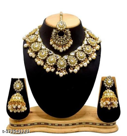 Enhance your ethnic charm with this White Kundan Necklace Set, beautifully crafted from premium alloy and finished with rich gold plating. Designed with lustrous pearls and intricate Kundan detailing, this necklace set is a perfect blend of royalty and tradition. Whether it’s a wedding, festival, engagement, or party, this jewellery set ensures you shine with elegance. Shop it now at https://dealdynamo.vinisocial.in . This gold-plated Kundan necklace with pearls is ideal for women and girls who want to look regal and stylish. The pearls symbolize purity and grace, while the gold plating adds a touch of luxury. Lightweight yet durable, it can be worn comfortably for long hours at weddings or festive functions. Find exclusive designs today at https://dealdynamo.vinisocial.in . Pair this stunning necklace set with sarees, lehengas, anarkalis, or even fusion outfits to make a grand statement. It is also an excellent choice for bridal jewellery, bridesmaids, or as a memorable gift for loved ones. Order now at https://dealdynamo.vinisocial.in . Curated by Renu Baliyan, Nity Baliyan, and Bharti Tomar, this jewellery set represents timeless artistry and high-quality craftsmanship. Every detail reflects cultural heritage blended with modern elegance. Discover more traditional and contemporary jewellery sets at https://dealdynamo.vinisocial.in . Perfect for weddings, anniversaries, birthdays, or festive gifting, this White Kundan Pearl Necklace Set is a must-have in every woman’s collection. With fine detailing, royal shine, and premium finish, this set guarantees compliments on every occasion. Don’t wait—grab it today from https://dealdynamo.vinisocial.in . For the best ethnic jewellery online, explore curated collections at https://dealdynamo.vinisocial.in .