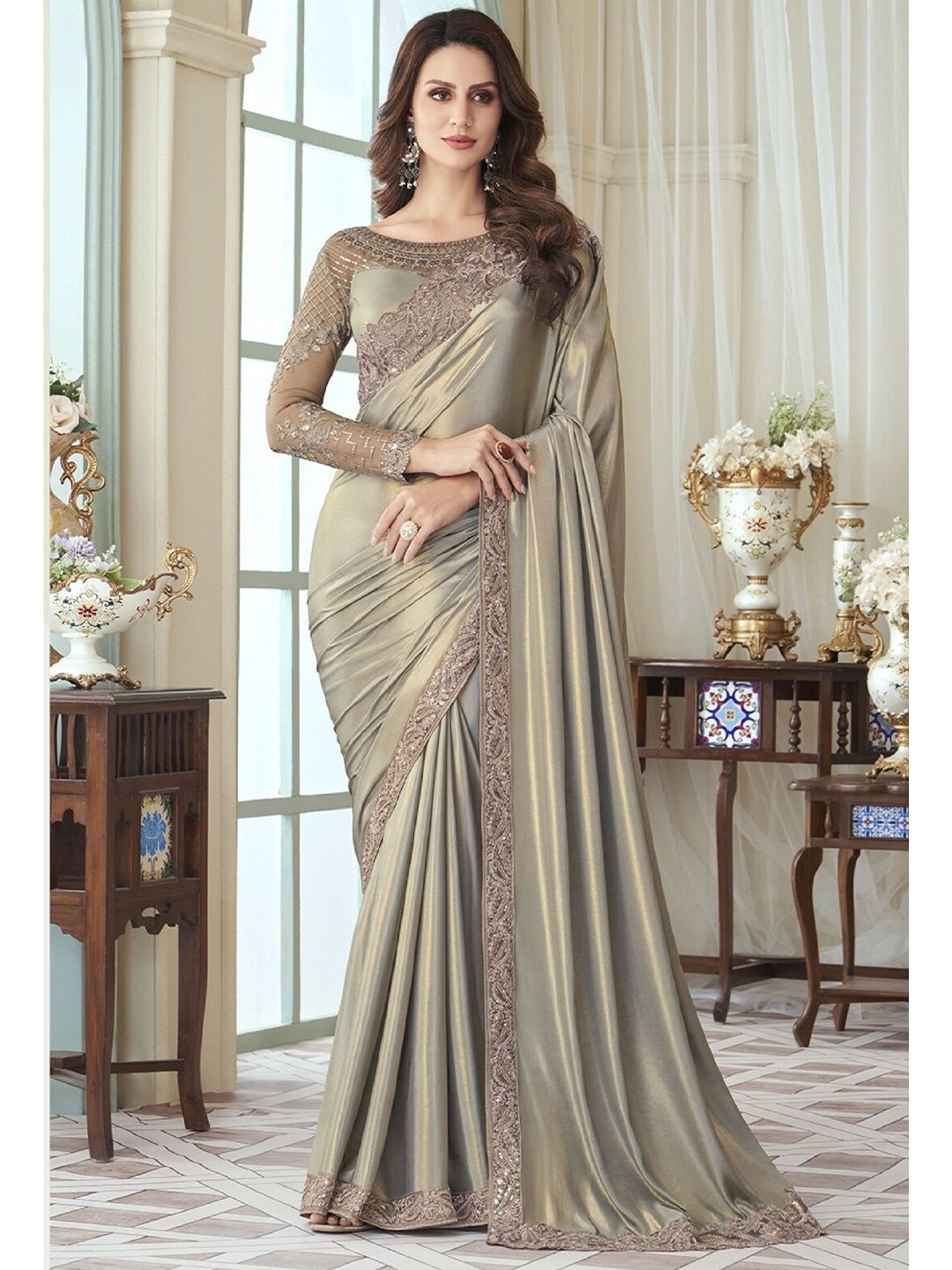 imgi_132_d4209b3c-7be0-4022-9ef7-ae1a625114fe1680259365087CreamEmbroideryWorkSareeWithUnstitchedBlousePiece1 Silk Blend fabric combines luxury with ease of wear. Elegant, lightweight, and versatile – perfect for weddings, parties, and office wear.