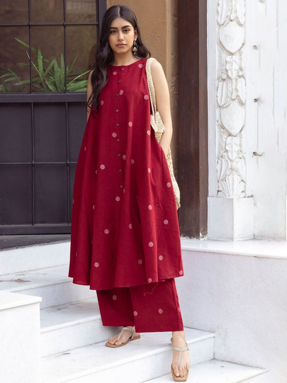 Product Details  Red and white geometric printed kurta with palazzos Kurta design: Geometric printed Anarkali shape Regular style Round neck, sleeveless  2 pockets Calf length with flared hem Viscose rayon machine weave fabric Palazzos design: Printed palazzos Elasticated waistband Slip-on closure Size & Fit The model (height 5'8) is wearing a size S Material & Care Kurta fabric : Viscose Rayon Bottom fabric : Viscose Rayon Dry Clean          Size Bust (in) Front Length (in) Sleeve-Length (in) To Fit Waist (in) Waist (in) Hips (in) Across Shoulder (in) Inseam Length (in) S 36.0 46.0 17.0 30.0 33.0 42.0 14.0 25.3 M 38.0 46.0 17.0 32.0 35.0 44.0 14.5 24.8 L 40.0 46.0 17.0 34.0 37.0 46.0 15.0 24.3 XL 42.0 46.0 17.0 36.0 39.0 48.0 15.5 23.8 XXL 44.0 46.0 17.0 38.0 41.0 50.0 16.0 24.3 3XL 46.0 46.0 17.0 40.0 43.0 52.0 16.5 23.8 4XL 48.0 46.0 17.0 42.0 45.0 54.0 17.0 23.3 5XL 50.0 46.0 17.0 44.0 47.0 56.0 17.5 22.8