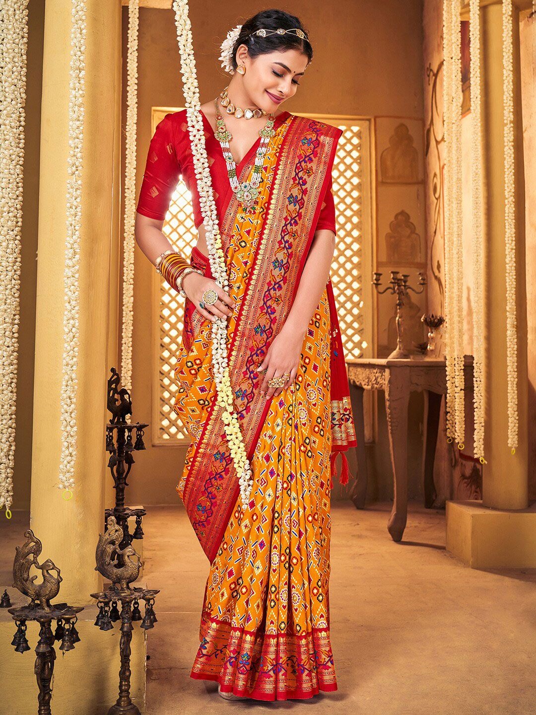 Product Details Design Details Navy blue and red patola saree Woven design saree with woven design border Has zari detail The saree comes with an unstitched blouse piece The blouse worn by the model might be for modelling purpose only. Check the image of the blouse piece to understand how the actual blouse piece looks like. Size & Fit Length: 5.5 metres plus 0.8 metre blouse piece Width: 1.06 metres (approx.) Material & Care Saree Fabric : Silk Blend Blouse Fabric: Silk Blend Dry Clean