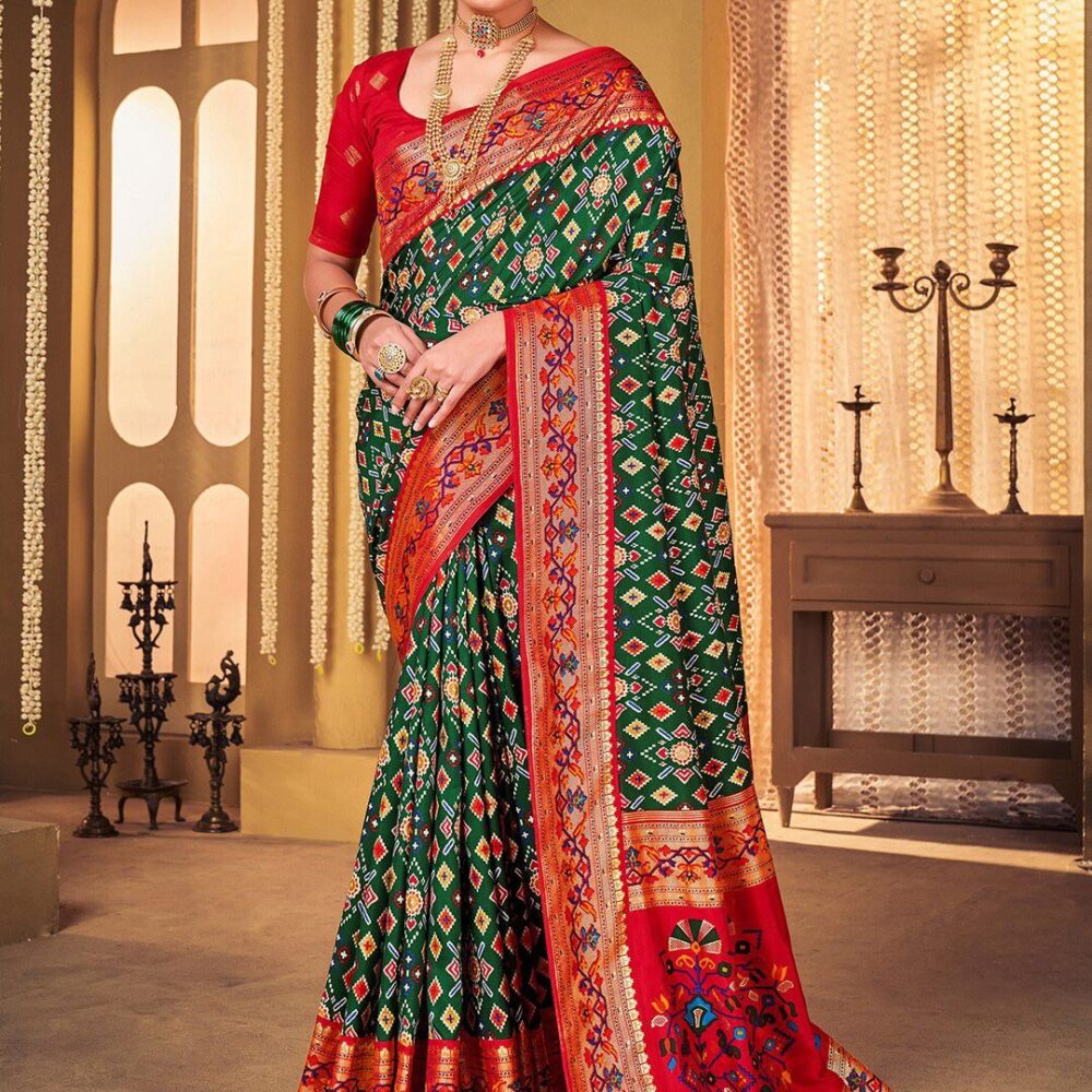 Product Details Design Details Navy blue and red patola saree Woven design saree with woven design border Has zari detail The saree comes with an unstitched blouse piece The blouse worn by the model might be for modelling purpose only. Check the image of the blouse piece to understand how the actual blouse piece looks like. Size & Fit Length: 5.5 metres plus 0.8 metre blouse piece Width: 1.06 metres (approx.) Material & Care Saree Fabric : Silk Blend Blouse Fabric: Silk Blend Dry Clean