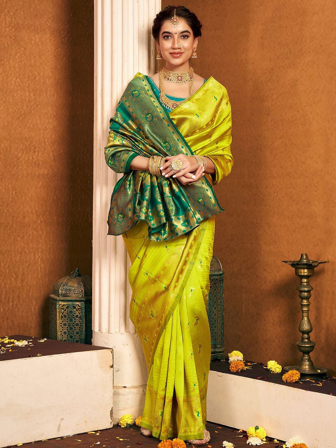 imgi_141_T90O0iLE_b24334293c20403b90176efb1a91fd12 Product Details Design Details Green and gold-toned paithani saree Woven design saree with woven design border Has zari detail The saree comes with an unstitched blouse piece The blouse worn by the model might be for modelling purpose only. Check the image of the blouse piece to understand how the actual blouse piece looks like. Size & Fit Length: 5.5 metres plus 0.8 metre blouse piece Width: 1.06 metres (approx.) Material & Care Saree and Blouse Fabric : Silk Blend Hand Wash