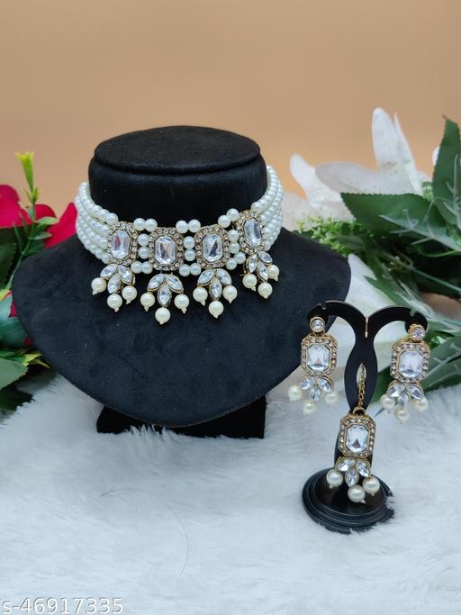 Elevate your ethnic and modern look with this Choker Jewellery Set, designed with a strong alloy base, rich gold plating, and adorned with dazzling Cubic Zirconia (American Diamond) stones. Perfect for women and girls, this choker set blends elegance and sparkle, making it ideal for weddings, parties, festive occasions, receptions, and anniversaries. Whether paired with sarees, lehengas, gowns, or Indo-western attire, it guarantees a glamorous statement. Shop this premium choker jewellery set today at https://dealdynamo.vinisocial.in . Crafted with precision, this gold-plated choker set is lightweight, durable, and comfortable for long wear. The shimmering American diamonds provide a rich diamond-like sparkle, adding sophistication without being overly heavy. Suitable for bridal wear, party wear, or festive gifting, it’s a versatile jewellery set every woman should own. Find exclusive collections at https://dealdynamo.vinisocial.in . Available only at https://dealdynamo.vinisocial.in , this jewellery set includes a beautifully designed choker necklace with matching earrings, completing your look with timeless elegance. It makes a perfect gift for birthdays, anniversaries, weddings, Karwa Chauth, and Diwali celebrations. Discover more American Diamond jewellery at https://dealdynamo.vinisocial.in . Exclusively listed and curated by Renu Baliyan, Nity Baliyan, and Bharti Tomar, this choker set represents premium craftsmanship and luxury at affordable prices. Whether you want to add glamour to your bridal ensemble or sparkle to your festive wardrobe, this piece delivers timeless style. Explore authentic gold-plated jewellery online at https://dealdynamo.vinisocial.in . From bridal elegance to party glamour, this Cubic Zirconia Choker Jewellery Set ensures you stand out at every occasion. Complete your jewellery box with this beautiful accessory and explore other premium CZ and American Diamond collections at https://dealdynamo.vinisocial.in . Order now at https://dealdynamo.vinisocial.in and add sparkle, tradition, and luxury to your jewellery collection.