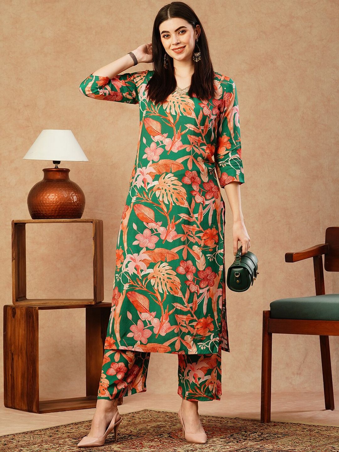 imgi_150_5904c221-d661-47e3-aacf-447b4f4cbd091707232494335KALINIWomenFloralPrintedRegularKurtawithPalazzos1 Product Details Green & pink printed Kurta with Palazzos Kurta design: Floral printed Straight shape Regular style V-neck, three-quarter regular sleeves Calf length with straight hem Cotton blend machine weave fabric Palazzos design: Solid Palazzos 1 Pocket Elasticated waistband Slip-on closure Size & Fit The model (height 5'8) is wearing a size S Material & Care Kurta Fabric: Cotton Blend Bottom Fabric: Cotton Blend Dry Clean Size Bust (in) Front Length (in) Sleeve-Length (in) To Fit Waist (in) Waist (in) Hips (in) Across Shoulder (in) Inseam Length (in) S 36.0 46.0 17.0 30.0 33.0 42.0 14.0 25.0 M 38.0 46.0 17.0 32.0 35.0 44.0 14.5 24.8 L 40.0 46.0 17.0 34.0 37.0 46.0 15.0 24.5 XL 42.0 46.0 17.0 36.0 39.0 48.0 15.5 24.3 XXL 44.0 46.0 17.0 38.0 41.0 50.0 16.0 24.0