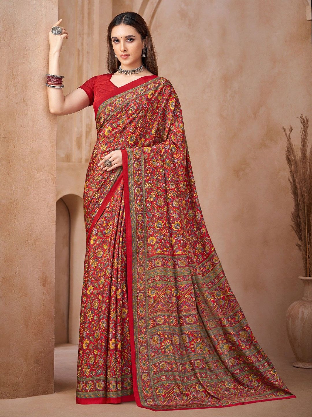 imgi_161_ftvIcvCC_f9676676842c48b4bebfe928b806ff1b Product Details Design Details Red and yellow saree Ethnic motifs printed saree with printed border The saree comes with an unstitched blouse piece The blouse worn by the model might be for modelling purpose only. Check the image of the blouse piece to understand how the actual blouse piece looks like. Size & Fit Length: 5.5 metres plus 0.8 metre blouse piece Width: 1.06 metres (approx.) Material & Care Saree fabric:Poly Crepe Blouse fabric: Poly Crepe Dry Clean