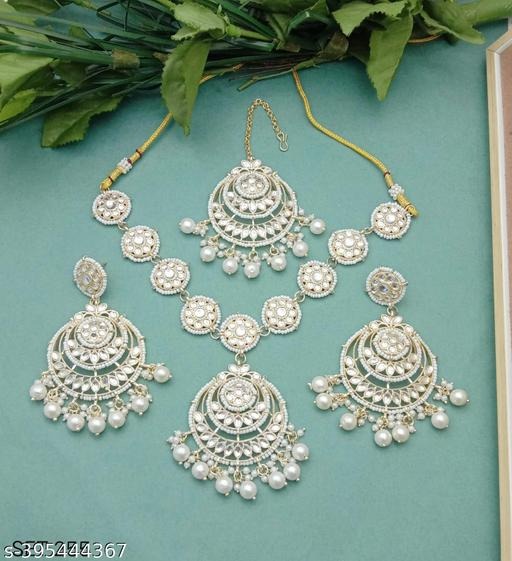 imgi_32_vfan7_512 Complete your ethnic look with this New Latest Necklace, Earrings & Maangtika Set, crafted from high-quality alloy with luxurious gold plating and embellished with lustrous pearls. Designed for women and girls who love elegance and tradition, this jewellery set is perfect for weddings, engagements, sangeet, mehendi, festivals, and parties. Shop exclusive collections now at https://dealdynamo.vinisocial.in . This bridal jewellery set with necklace, earrings & maangtika is lightweight yet durable, making it comfortable to wear for long hours. The pearls add a royal touch, while the gold plating ensures a radiant shine. Ideal for pairing with sarees, lehengas, gowns, and Indo-western outfits, it creates a regal bridal and festive look. Order now at https://dealdynamo.vinisocial.in . Perfect as a wedding jewellery set for brides, festive pearl jewellery, party wear necklace earrings set, or even as a gifting option for anniversaries and birthdays, this set is a must-have addition to every woman’s collection. Browse more stunning designs of bridal pearl maangtika sets, traditional Indian necklaces, gold-plated bridal jewellery, and women’s ethnic jewellery exclusively at https://dealdynamo.vinisocial.in . Curated by Renu Baliyan, Nity Baliyan, and Bharti Tomar, this collection includes handcrafted bridal jewellery sets, ethnic pearl necklaces, party wear choker necklaces, and gold plated jewellery for women. From Kundan bridal sets, festival jewellery with maangtika, traditional wedding jewellery collections, to premium pearl necklace sets, everything you need is available at https://dealdynamo.vinisocial.in . Whether you are the bride, bridesmaid, or a wedding guest, this necklace, earrings & maangtika set is a timeless accessory. Explore the latest bridal jewellery for women, designer necklace sets online, festival wear pearl jewellery, Indian wedding jewellery gift sets, and gold-plated ethnic jewellery for girls now at https://dealdynamo.vinisocial.in . Make your special occasions even more memorable with jewellery that speaks of elegance, grace, and tradition. Shop today at https://dealdynamo.vinisocial.in .