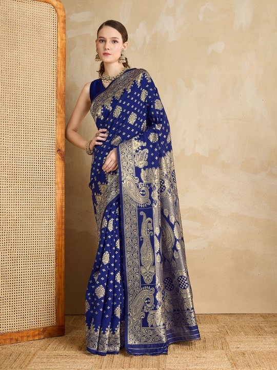 Product Details Design Details Maroon and gold-toned banarasi saree Woven design saree with woven design border border Has zari detail The saree comes with an unstitched blouse piece The blouse worn by the model might be for modelling purpose only. Check the image of the blouse piece to understand how the actual blouse piece looks like. Size & Fit Length: 5.5 metres plus 0.8 metre blouse piece Width: 1.06 metres (approx.) Material & Care Silk Blend Dry Clean