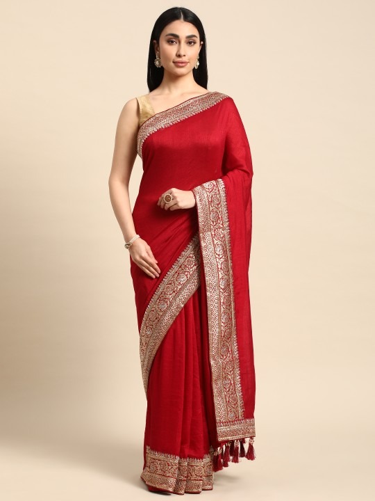 Product Details Design Details Red saree Solid saree with woven design border border Has zari detail The saree comes with an unstitched blouse piece The blouse worn by the model might be for modelling purpose only. Check the image of the blouse piece to understand how the actual blouse piece looks like. Size & Fit Length: 5.5 metres plus 0.8 metre blouse piece Width: 1.06 metres (approx.) Material & Care Art Silk Hand Wash