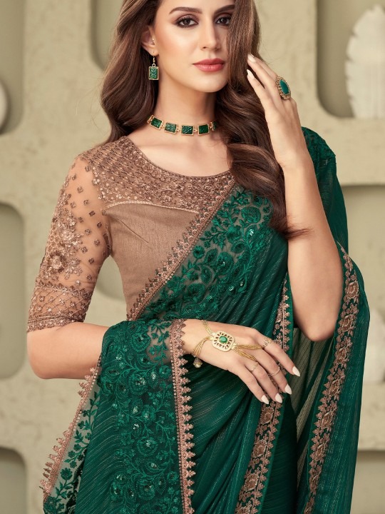 Silk Blend Saree, Green Saree Online, Gold Toned Saree, Sequined Silk Saree, Woven Design Saree, Wedding Saree Green, Party Wear Silk Saree, Festive Saree Online, Bollywood Designer Saree, Green & Gold Saree, Reception Saree India, Premium Sarees 2025, Silk Blend Sequined Saree, Luxury Saree Online, Designer Silk Blend Saree πΉ Big Product Description Add a royal touch to your wardrobe with our Silk Blend Green & Gold-Toned Woven Design Sequined Saree, a stunning creation that beautifully blends traditional weaving with modern sequin embellishments. Crafted from premium silk blend fabric, this saree reflects richness and luxury, perfect for weddings, receptions, festive functions, and cultural celebrations. The deep green base with golden woven zari patterns highlights regal charm, while the delicate sequins add a sparkling effect that shines gracefully under lights. The combination of woven motifs, rich silk texture, and sequin work creates a saree that is both traditional and contemporary. π Saree Highlights Fabric: Premium silk blend with smooth texture Colour: Rich green with golden woven detailing Design: Traditional zari weaving with modern sequined highlights Occasions: Ideal for weddings, receptions, festive celebrations, Karva Chauth, Diwali & grand parties Style Tip: Pair with gold jewelry, bangles & embellished clutch for a majestic look Care: Dry clean only to maintain fabric sheen & sequin detailing πΉ Why Choose This Saree? This saree is perfect for women who love heritage-inspired designs with a glamorous touch. The woven zari detailing in gold symbolizes elegance and tradition, while the sequins bring modern shine β making it versatile for day weddings and evening functions alike. Whether youβre a brideβs sister, wedding guest, or festive host, this saree ensures you look regal, graceful, and stylish. πΉ Long-Tail SEO Keywords (naturally included) silk blend green & gold-toned saree with sequins online luxury woven silk blend saree for weddings and receptions designer sequined saree in green with golden zari work traditional silk blend saree with woven motifs India green silk blend wedding saree with sequin highlights premium party wear silk saree with woven design Bollywood style green and gold saree online shopping best festive saree for Diwali & wedding celebrations silk blend woven saree with sequins latest design 2025 designer sarees India β silk blend with zari and sequins π Available exclusively on dealdynamo.vinisocial.in, proudly managed by Renu Baliyan, Nity Baliyan, and Bharti Tomar β professional owners committed to delivering premium designer sarees with quality and trust.