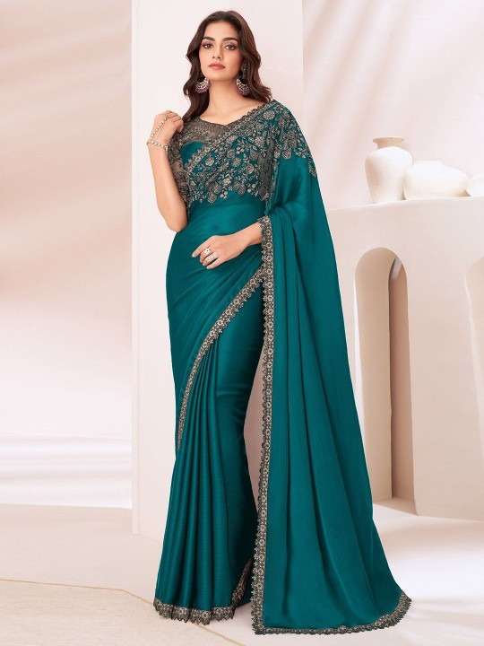 Product Details Design Details Black and grey saree Solid saree with embellished border border Has sequinned detail The saree comes with an unstitched blouse piece The blouse worn by the model might be for modelling purpose only. Check the image of the blouse piece to understand how the actual blouse piece looks like. Size & Fit Length: 5.5 metres plus 0.8 metre blouse piece Width: 1.06 metres (approx.) Material & Care Dry Clean