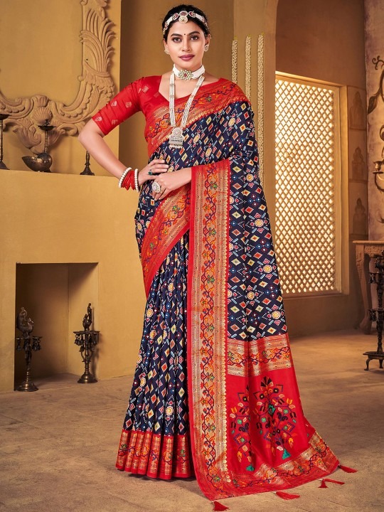 Product Details Design Details Navy blue and red patola saree Woven design saree with woven design border Has zari detail The saree comes with an unstitched blouse piece The blouse worn by the model might be for modelling purpose only. Check the image of the blouse piece to understand how the actual blouse piece looks like. Size & Fit Length: 5.5 metres plus 0.8 metre blouse piece Width: 1.06 metres (approx.) Material & Care Saree Fabric : Silk Blend Blouse Fabric: Silk Blend Dry Clean