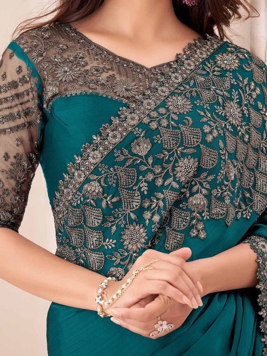 imgi_79_qShgsci0_7044871b02a84d8d81834e46bce8e951 Product Details Design Details Black and grey saree Solid saree with embellished border border Has sequinned detail The saree comes with an unstitched blouse piece The blouse worn by the model might be for modelling purpose only. Check the image of the blouse piece to understand how the actual blouse piece looks like. Size & Fit Length: 5.5 metres plus 0.8 metre blouse piece Width: 1.06 metres (approx.) Material & Care Dry Clean