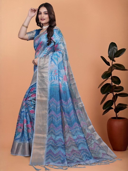 Product Details Women Blue Ethnic Motifs Zari Silk Blend Banarasi Saree With Blouse Piece Size & Fit Length: 5.5 metres plus 0.8 metre blouse piece Width: 1.06 metres (approx.) Material & Care fabric offers a luxurious feel with a smooth texture and a subtle sheen. The durability and comfort of blended fibers, making it lightweight, breathable, and easy to drape. This material ensures a refined look while maintaining ease of maintenance and wearability for various occasions.